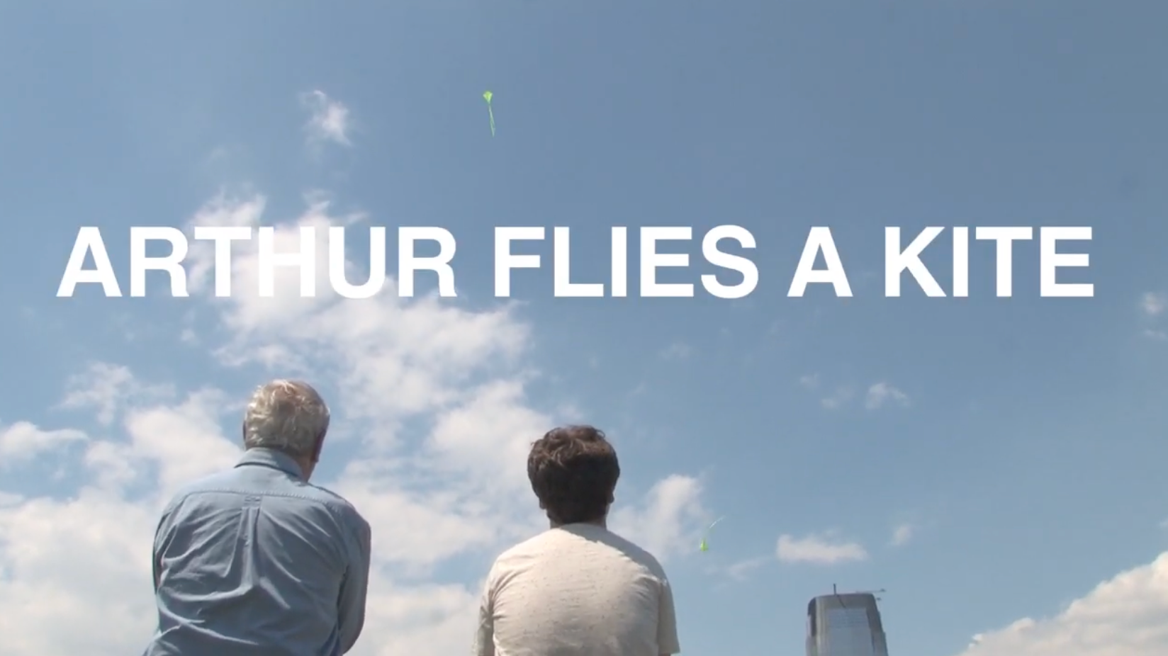 Arthur Flies a Kite title card, with Arthur Albert and Alexander Weiss beneath a blue sky