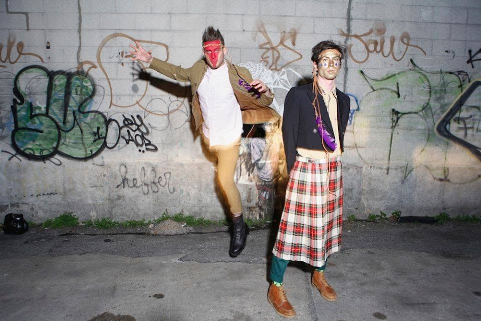Hunter&Game: a joyful leap in front of a graffiti-covered wall